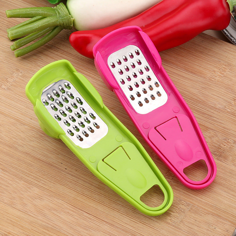 Garlic grater grating a clove