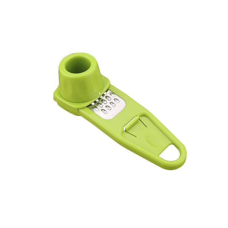 Lime green twist garlic grater with stainless steel grating plate